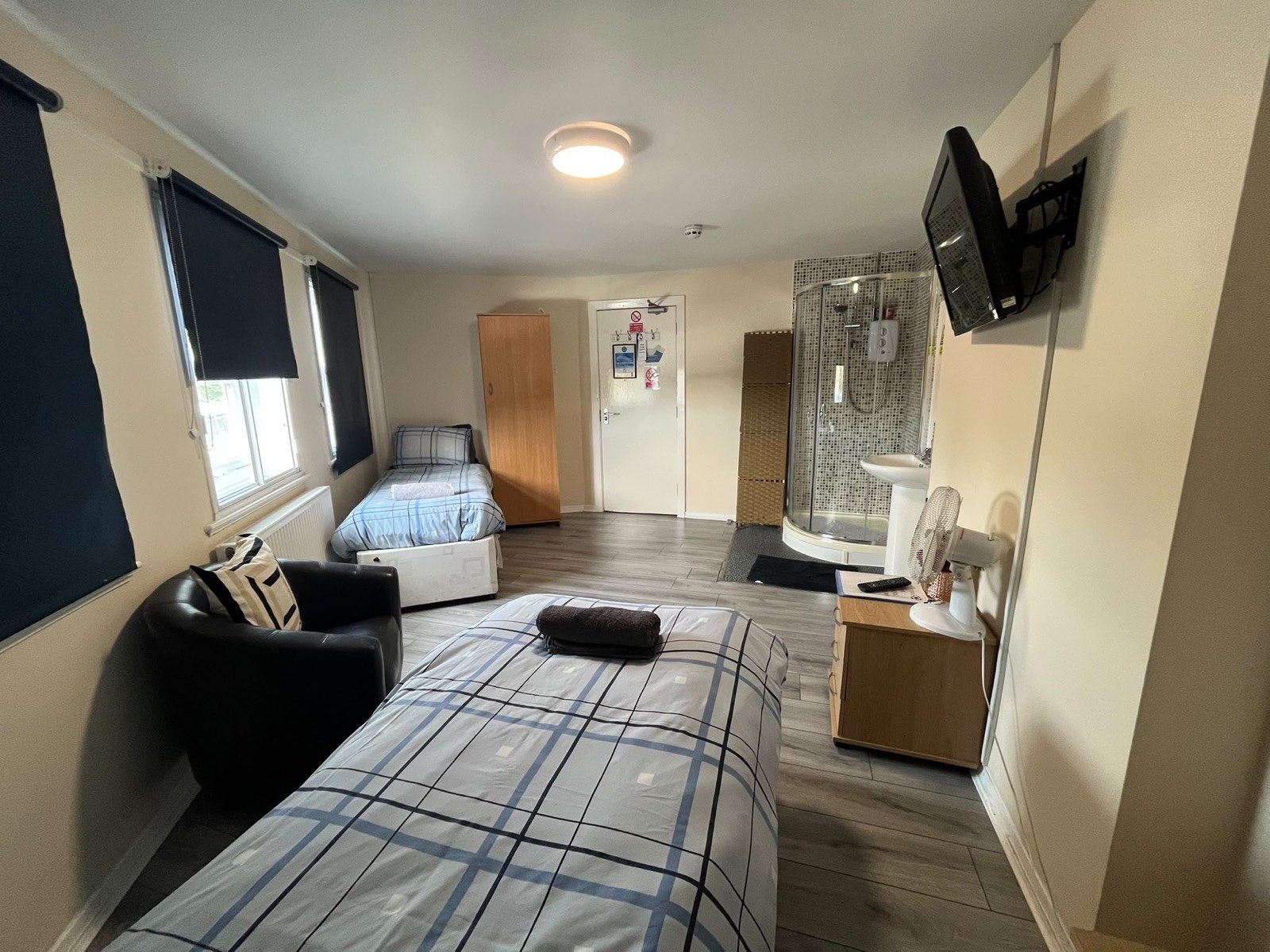 The double bed and window with blackout blinds
